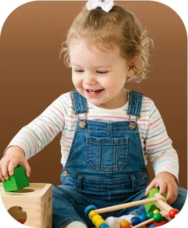 A toddler happily playing with a colorful wooden shape sorter and soft blocks, showcasing the engaging Nova Mart 1-2 Years collection.