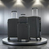 Four-piece Nova Mart ABS hardside luggage set with a matching cosmetic case, featuring sturdy design and multiple compartments.