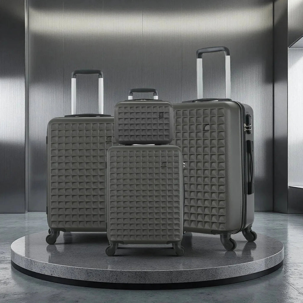 Four-piece Nova Mart ABS hardside luggage set with a matching cosmetic case, featuring durable, sleek suitcases for travel.