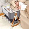 Foldable Nova Mart 3-in-1 baby bassinet with wheels and rocking feature, designed for easy bedside use and portability.