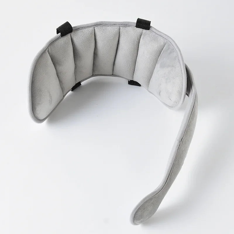 Adjustable baby car seat head support strap by Nova Mart, designed to keep baby's head comfortable and secure during car rides.