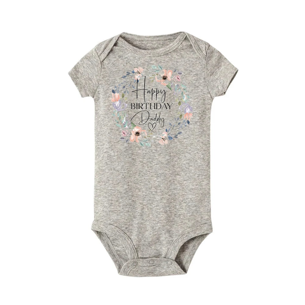 Baby boy's short sleeve birthday bodysuit from Nova Mart with festive "Happy Birthday Daddy" print, perfect for summer rompers.