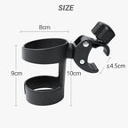Universal baby stroller cup holder by Nova Mart, showing a black plastic drink rack attached to a stroller frame.