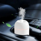 A user easily refilling the 220ML USB Humidifier, highlighting its transparent water tank and visible fine mist output for re