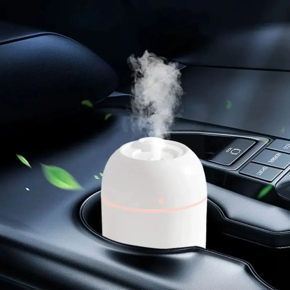 A user easily refilling the 220ML USB Humidifier, highlighting its transparent water tank and visible fine mist output for re
