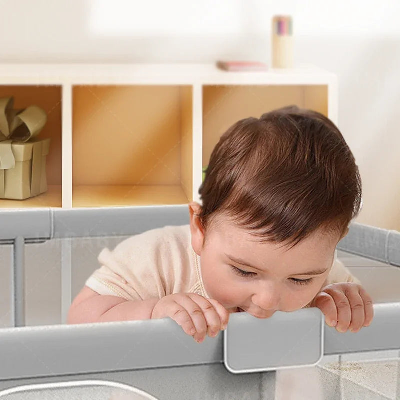 Light gray baby playpen by Nova Mart with pull ring and ball box, designed for safe play areas for infants and toddlers.