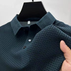 Men's business casual bone-colored Polo shirt by Nova Mart with a floral pattern, displayed on a hanger.