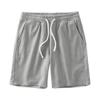 Men's waffle texture shorts by Nova Mart featuring a loose fit, drawstring waist, ideal for casual summer wear.