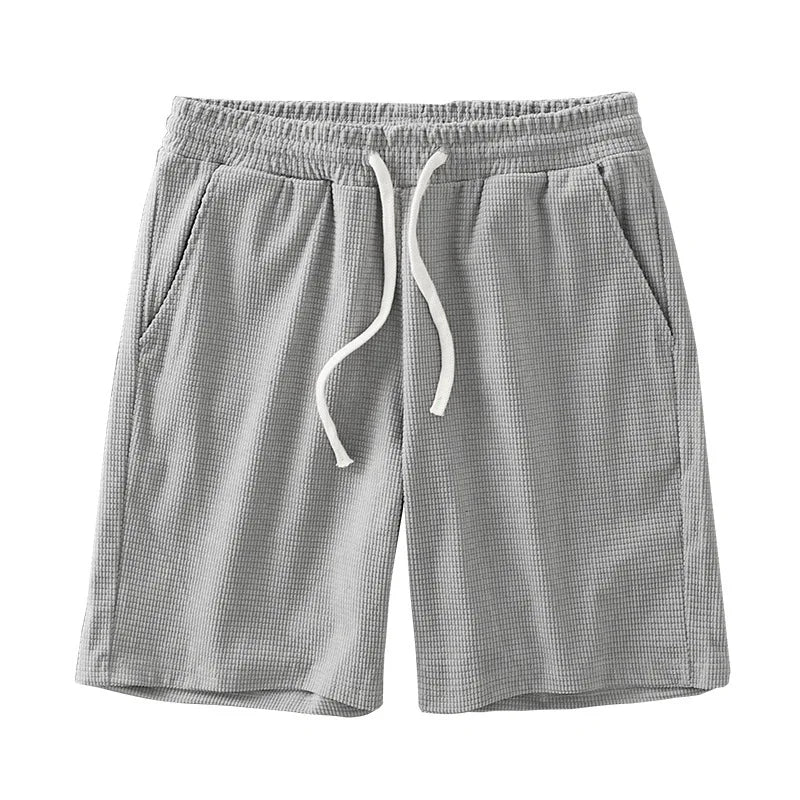 Men's waffle texture shorts by Nova Mart featuring a loose fit, drawstring waist, ideal for casual summer wear.
