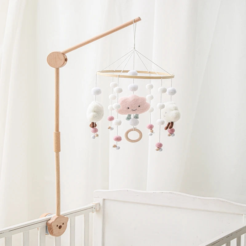 Baby wooden crib mobile with cloud-shaped hanging rattle toy and bracket, designed for soothing infants in cribs