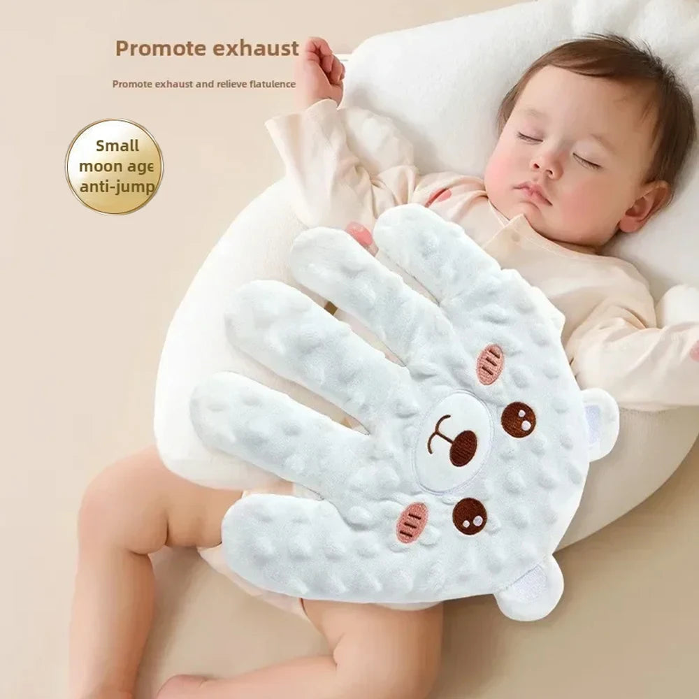 Nova Mart baby sleep aid palm pillow with remote control, soft soothing design for calming infants and promoting restful sleep.
