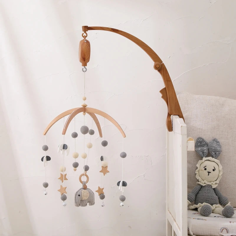Nova Mart DIY baby crib bed bell holder arm with rotating music box, featuring colorful toy and adjustable attachment for infants.