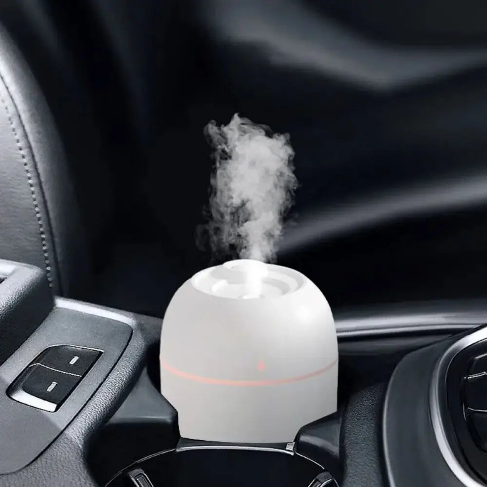 Close-up of a sleek, white 220ML USB humidifier with whisper-quiet operation, ideal for desktops or bedrooms.