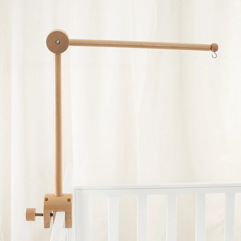 Baby wooden crib mobile with cloud-shaped hanging rattle toy and bracket, designed for soothing nursery decor.