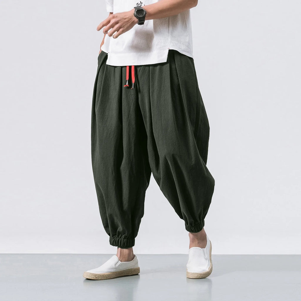 Men's oversize loose linen harem pants by Nova Mart, showcasing relaxed fit and lightweight fabric with an elastic waistband.