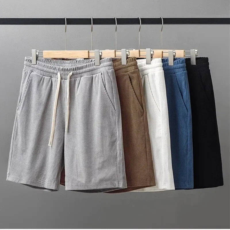 Men's waffle texture shorts by Nova Mart, loose fit casual summer shorts with drawstring waist in relaxed style.