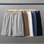 Men's waffle texture shorts by Nova Mart, loose fit casual summer shorts with drawstring waist in relaxed style.