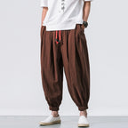 Men's loose linen harem pants by Nova Mart, oversized and relaxed fit, showcasing lightweight breathable fabric and comfortable design.