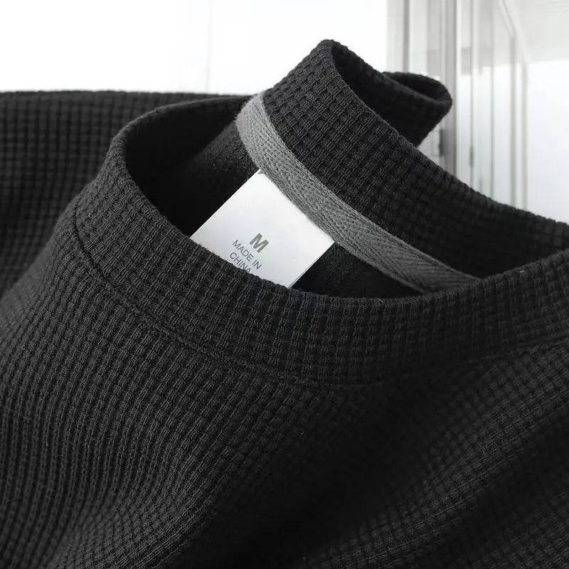 Unisex waffle knit T-shirt in solid color, casual men's fashion by Nova Mart, featuring a loose fit and comfortable fabric.