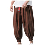 Men's oversize loose linen harem pants by Nova Mart, featuring relaxed fit and breathable fabric, shown in a neutral color.