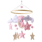 Wooden baby mobile and crib bell rattle toy from Nova Mart, featuring a music box design for newborns and infants up to 12 months