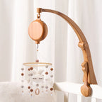 Nova Mart DIY baby crib bed bell holder arm with rotating music box, featuring colorful toy and secure attachment for infant crib.
