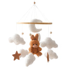 Wooden crib mobile by Nova Mart featuring soft felt cartoon bear and music box for baby’s crib decor and soothing entertainment.
