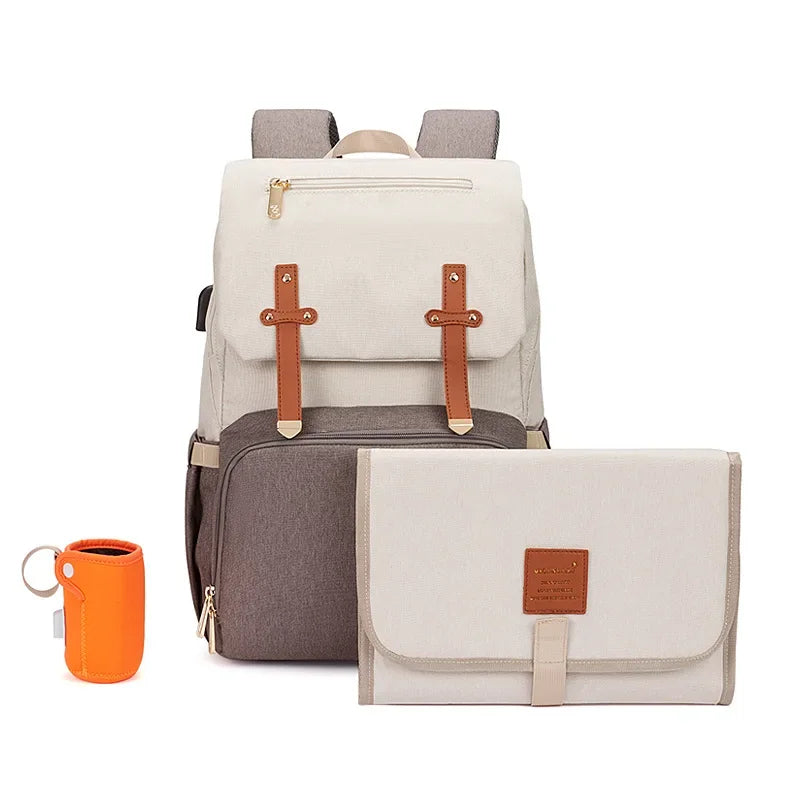 Nova Mart denim baby diaper bag backpack with thermal bottle pocket, featuring multiple compartments and adjustable straps.