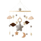 Wooden baby crib rattle toy with crochet bed bell bracket, suitable for 0-12 months, by Nova Mart, displayed on a crib.