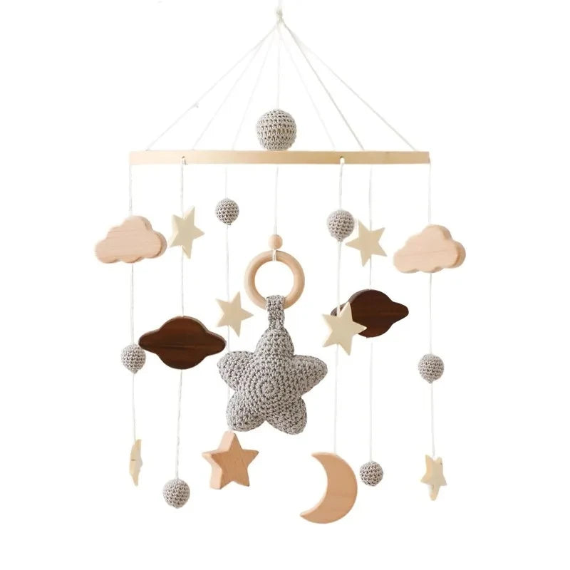 Wooden baby crib rattle toy with crochet bed bell bracket, suitable for 0-12 months, by Nova Mart, displayed on a crib.