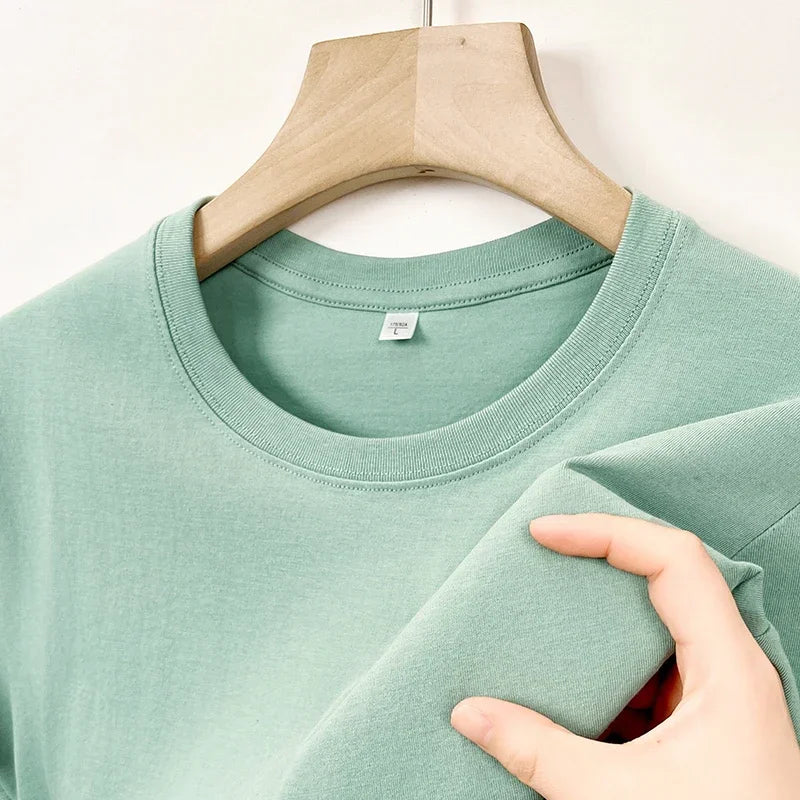 Men's Korean casual cotton round neck T-shirt by Nova Mart, shown in a relaxed fit with soft fabric and simple design.