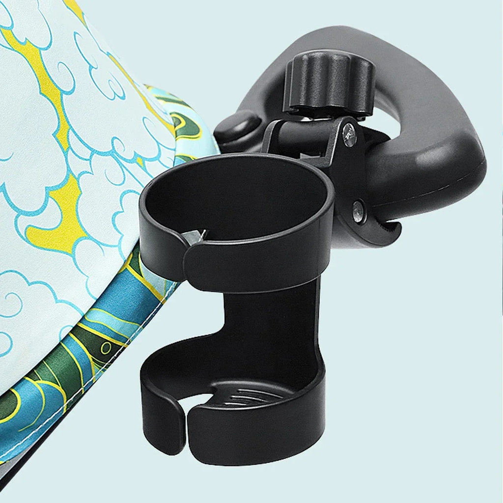Universal baby stroller cup holder by Nova Mart attached to a stroller handle, holding a water bottle and drink cup.