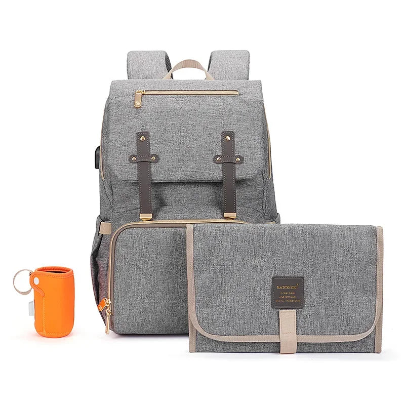 Nova Mart denim diaper bag backpack with thermal bottle pocket, stylish and functional baby diaper bag for parents.