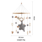 Wooden crochet star baby crib mobile with bell and rattle toy from Nova Mart, featuring colorful stars for soothing infant entertainment.