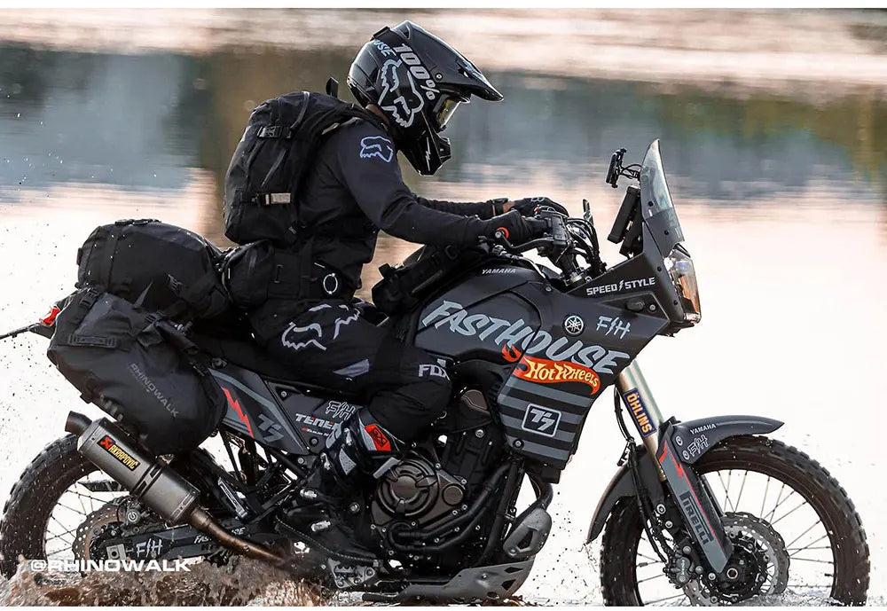Rhinowalk waterproof motorcycle pannier saddle bags in black mounted on a motorcycle, designed for durable gear storage.