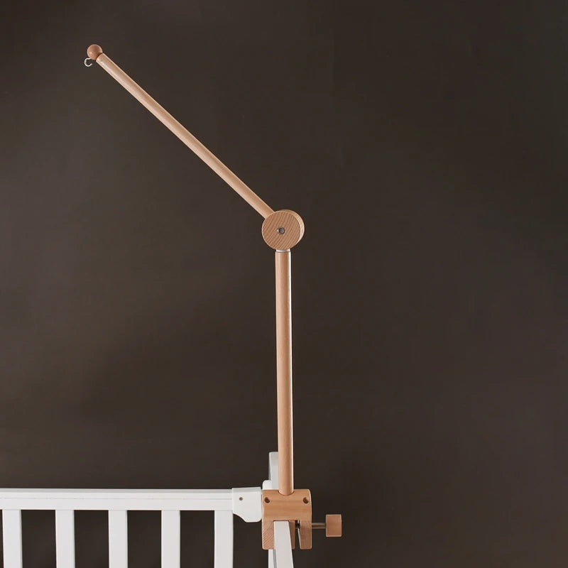 Baby wooden crib mobile with cloud-shaped hanging rattle toy and bracket, designed for gentle, soothing nursery decor.