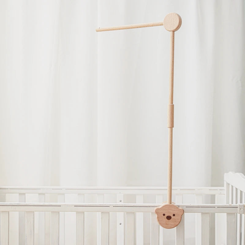Baby wooden crib mobile with cloud-shaped hanging rattle toy on a bracket, designed for infant cribs by Nova Mart.