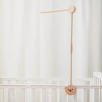 Baby wooden crib mobile with cloud-shaped hanging rattle toy on a bracket, designed for infant cribs by Nova Mart.