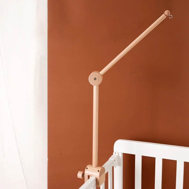 Wooden baby crib mobile with cloud-shaped hanging rattle toy and bracket, designed for soothing baby sleep and entertainment.