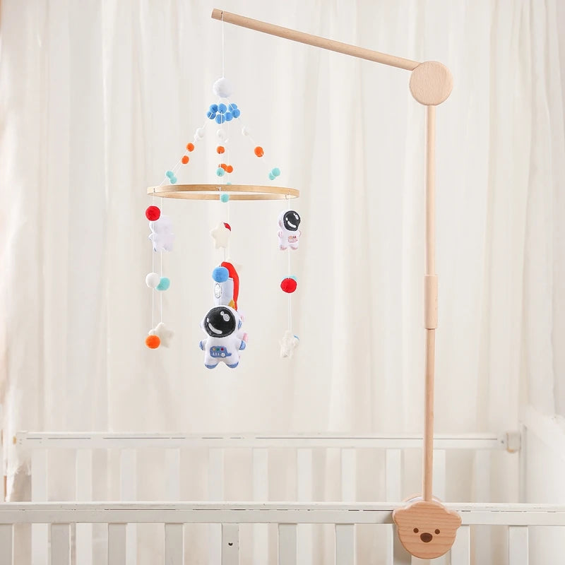 Baby wooden cloud-shaped crib mobile with hanging rattle toy and bracket, designed for soothing nursery decor.