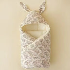 Soft cotton newborn swaddle blanket with cute bunny ears by Nova Mart, ideal for hospital wrap and baby comfort.