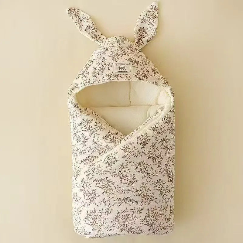 Soft cotton newborn swaddle blanket with cute bunny ears by Nova Mart, ideal for hospital wrap and baby comfort.