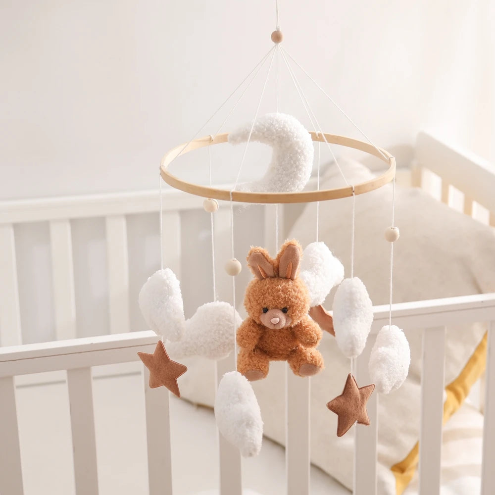 Wooden baby crib mobile with soft felt cartoon bear and music box, designed by Nova Mart for soothing nursery decor.