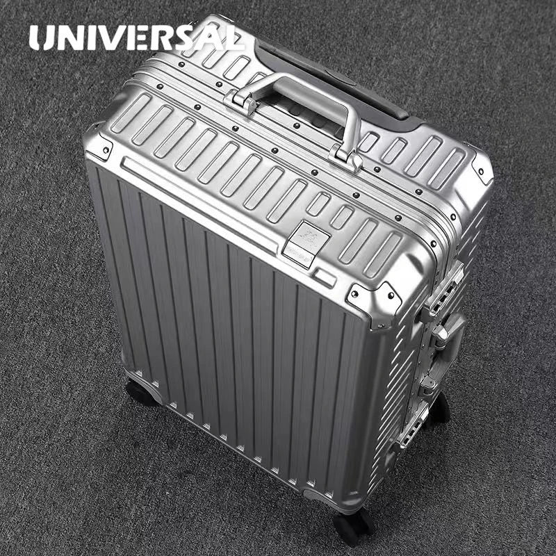 Silver aluminum frame hardcase luggage with universal wheels, durable Nova Mart travel suitcase with sturdy handle and secure locks.