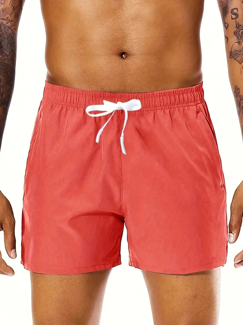 Men's beach sports shorts with elastic waist and double pockets, perfect for summer, by Nova Mart.