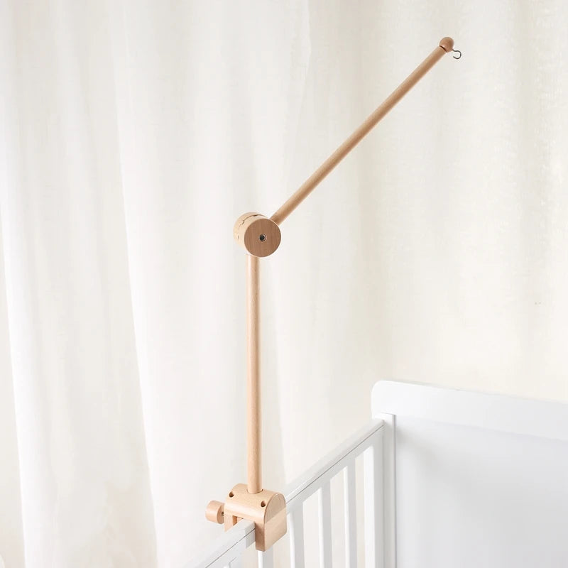 Baby wooden cloud-shaped crib mobile with hanging rattles and toy bracket by Nova Mart, designed to entertain and soothe infants.