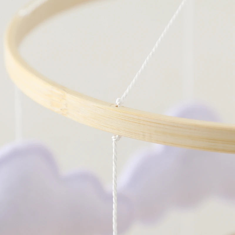 Wooden baby mobile and crib bell rattle toy by Nova Mart with colorful hanging figures for newborns and infants.