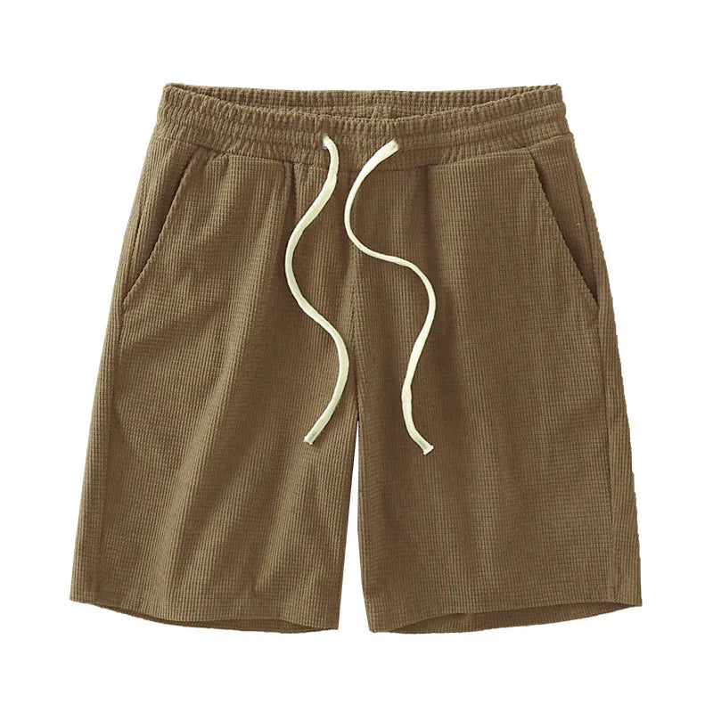 Men's waffle texture shorts by Nova Mart featuring a loose fit and drawstring waist, ideal for casual summer wear.