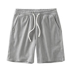 Men's navy waffle texture shorts with loose fit and drawstring waist, ideal for casual summer wear by Nova Mart