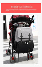 Nova Mart denim baby diaper bag backpack with thermal bottle pocket, featuring multiple compartments and adjustable straps.